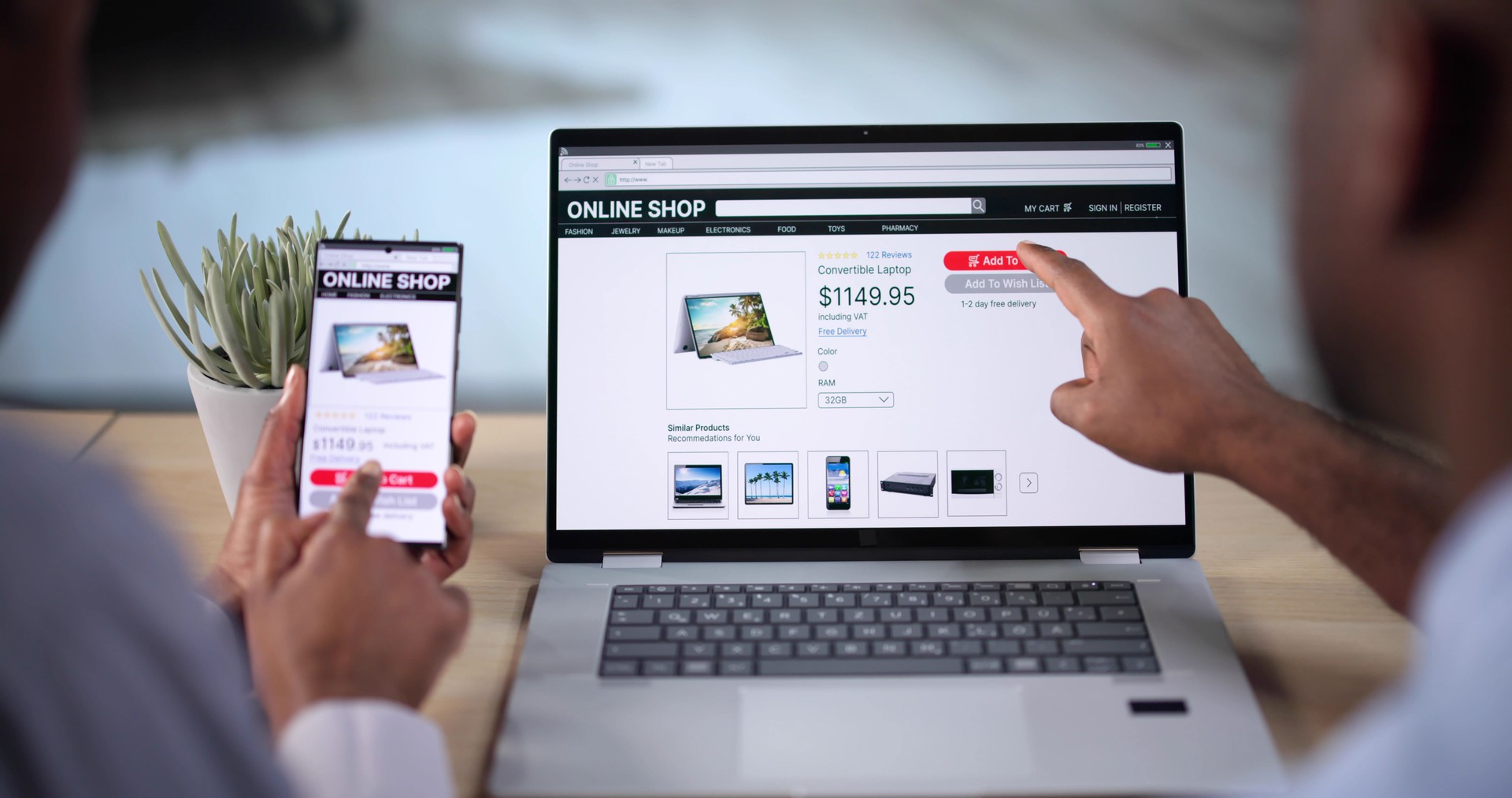 African Woman And Man Doing Online Shopping On Laptop